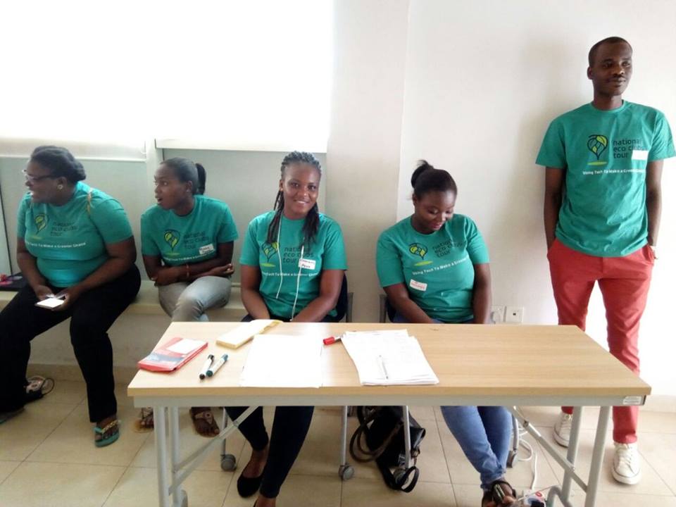 A Ghanaian environmental initiative team gathered around a work table