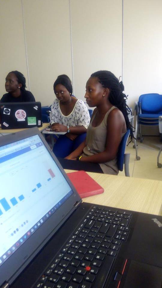Young Ghanaian women participating in a laptop-based technology workshop